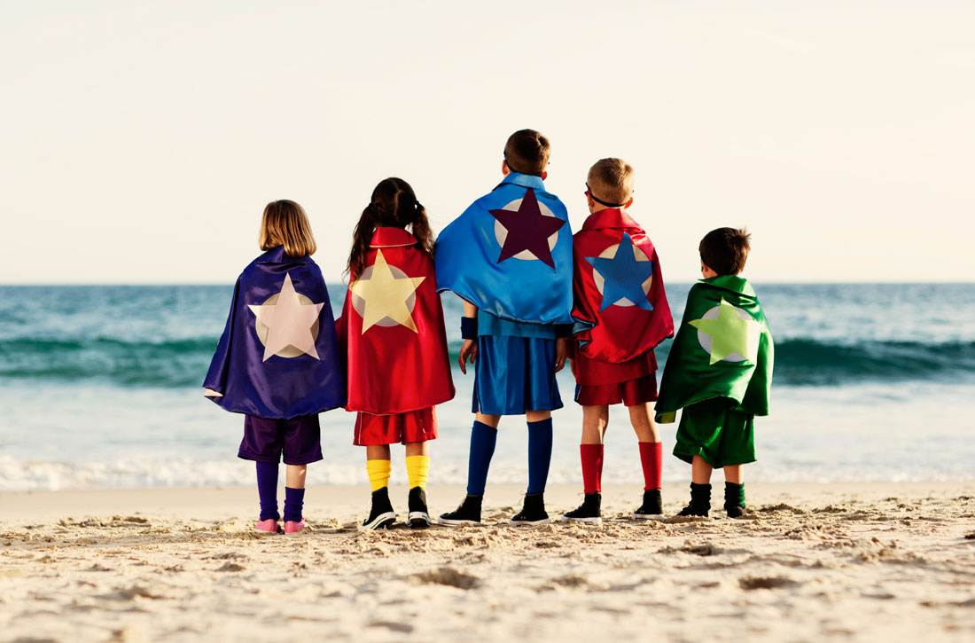 The Back of a Few Kids in Superhero Costume